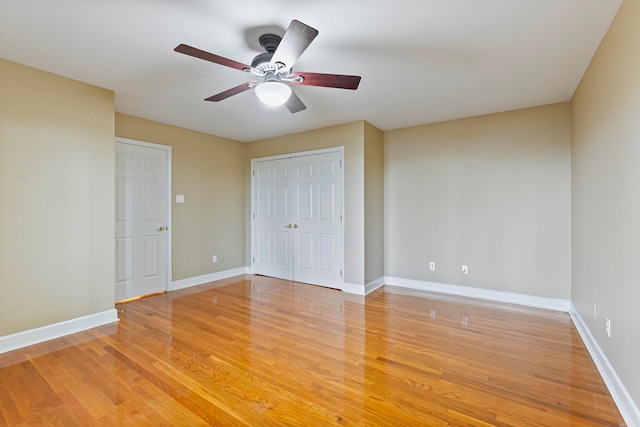 unfurnished bedroom with light hardwood / wood-style flooring and ceiling fan