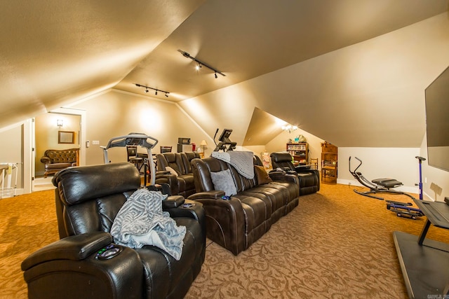 cinema room featuring light carpet, lofted ceiling, and rail lighting