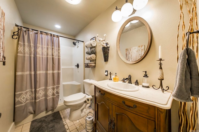 bathroom featuring vanity, toilet, and tile patterned flooring