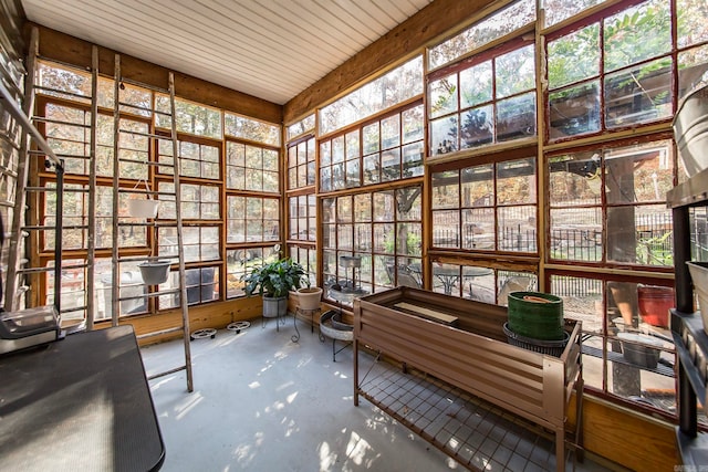 sunroom / solarium featuring a hot tub and plenty of natural light