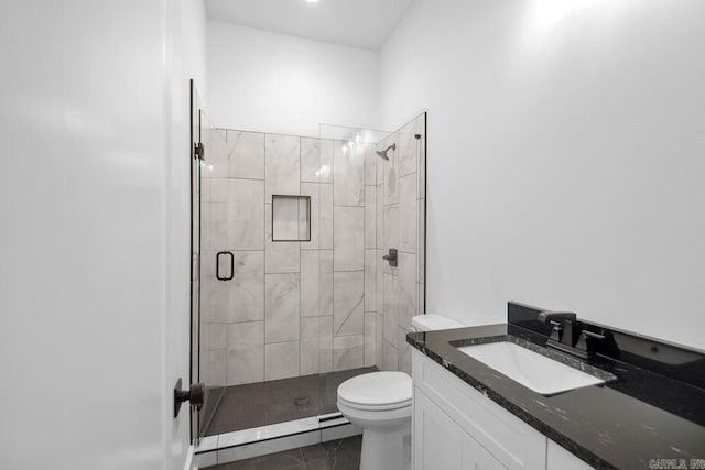 bathroom with vanity, toilet, tile patterned floors, and an enclosed shower