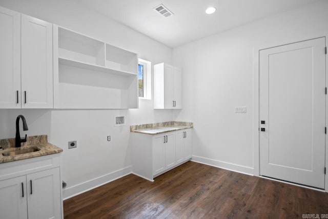 laundry area with washer hookup, dark wood-type flooring, hookup for an electric dryer, sink, and cabinets