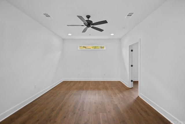 unfurnished room featuring ceiling fan and dark hardwood / wood-style flooring