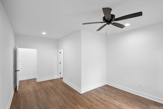 unfurnished room with hardwood / wood-style floors and ceiling fan