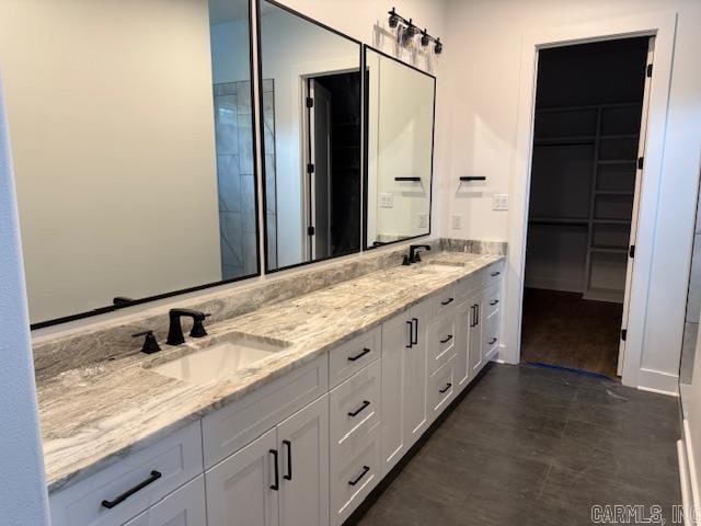 bathroom featuring vanity and hardwood / wood-style flooring