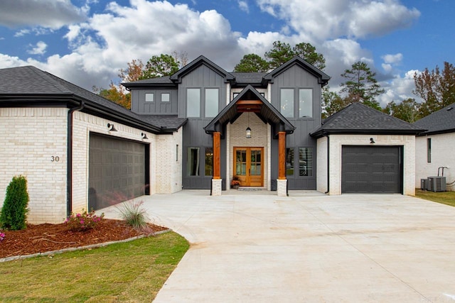 modern inspired farmhouse with central AC and a garage