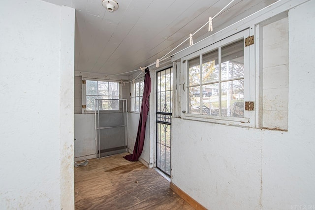 hall with wood-type flooring