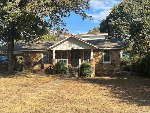 view of front of property with a porch and a front lawn