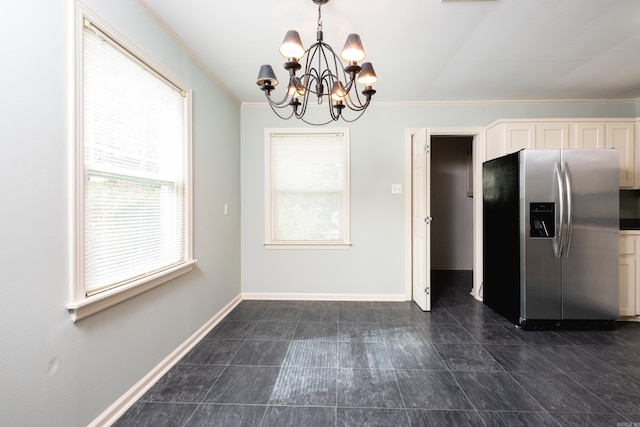 kitchen with ornamental molding, stainless steel fridge with ice dispenser, hanging light fixtures, and white cabinets