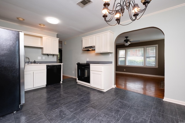 kitchen with fridge, white cabinetry, black dishwasher, and decorative light fixtures