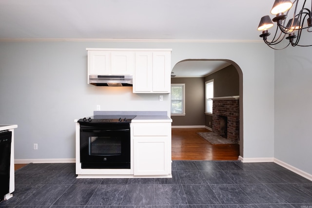 kitchen with white cabinetry, crown molding, and range with electric cooktop