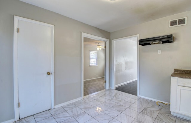 interior space featuring light hardwood / wood-style floors and ceiling fan