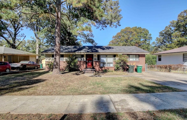 ranch-style home featuring a front yard and covered porch