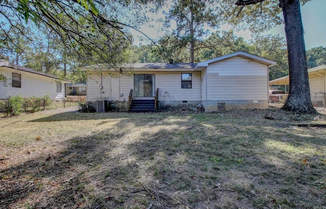 back of house with a yard