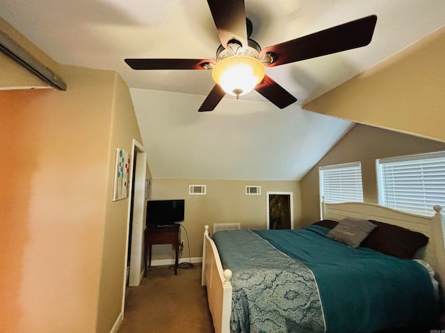 bedroom with vaulted ceiling, carpet floors, and ceiling fan