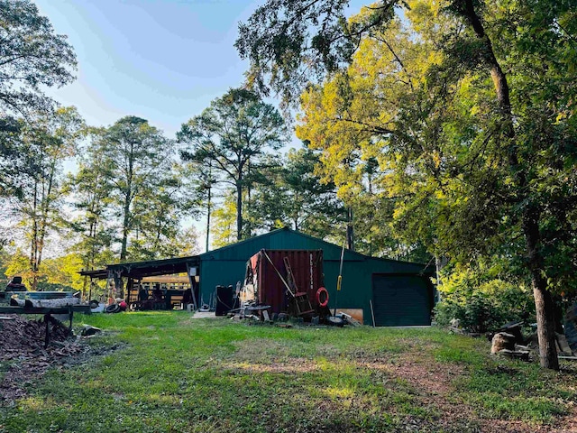 view of outbuilding featuring a lawn