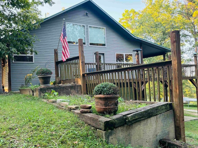 exterior space with a front yard and a deck