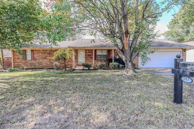 single story home featuring a garage and a front lawn