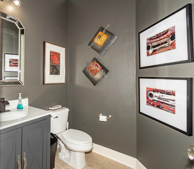 bathroom featuring vanity, toilet, and tile patterned floors