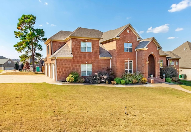 view of front property featuring a front yard and a garage