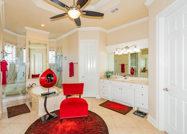 bathroom featuring vanity, crown molding, independent shower and bath, and tile patterned floors