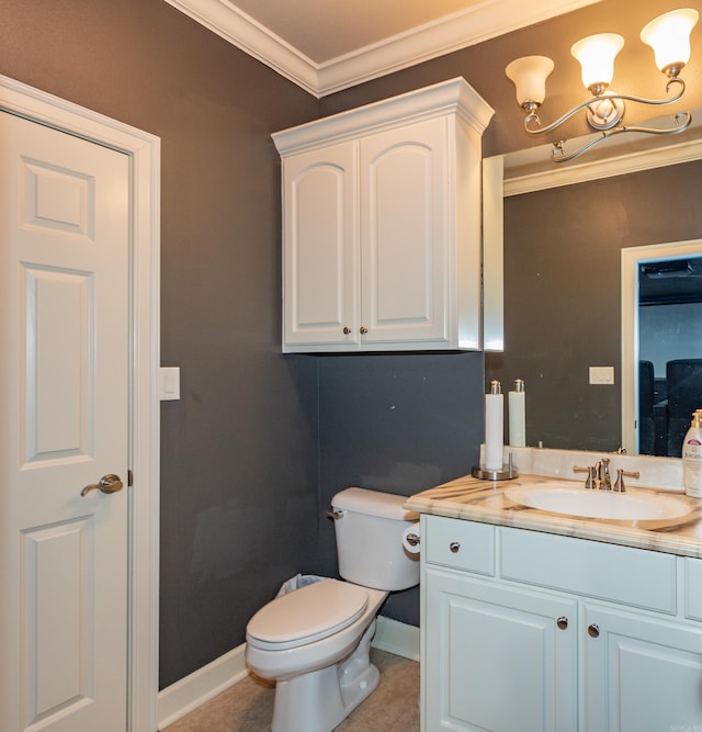 bathroom featuring vanity, crown molding, toilet, and tile patterned floors