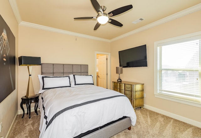 carpeted bedroom featuring ceiling fan and crown molding