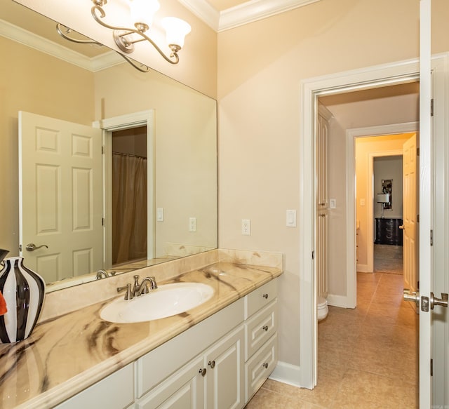 bathroom with vanity, toilet, crown molding, and tile patterned floors