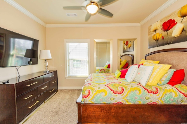 bedroom featuring crown molding, light colored carpet, and ceiling fan