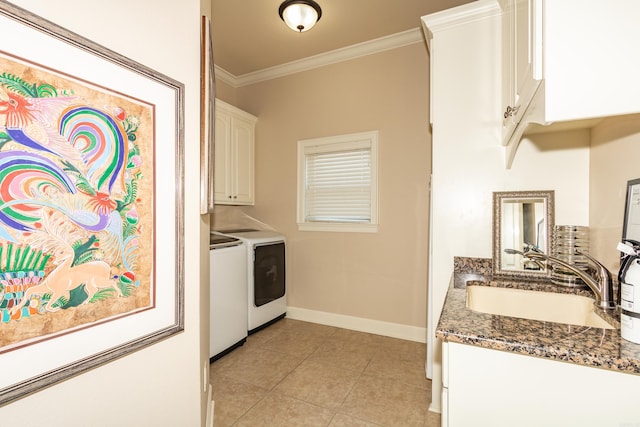 laundry area featuring sink, separate washer and dryer, cabinets, ornamental molding, and light tile patterned floors