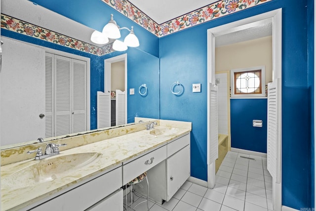 bathroom featuring vanity, shower / tub combination, and tile patterned flooring