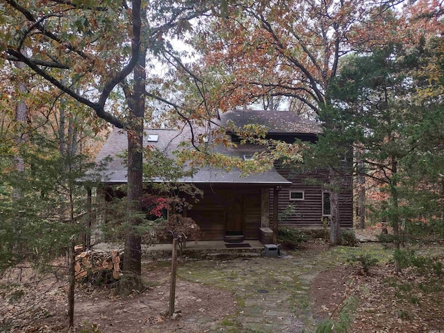 view of side of property with a porch