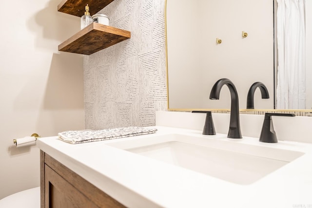 bathroom with vanity and toilet