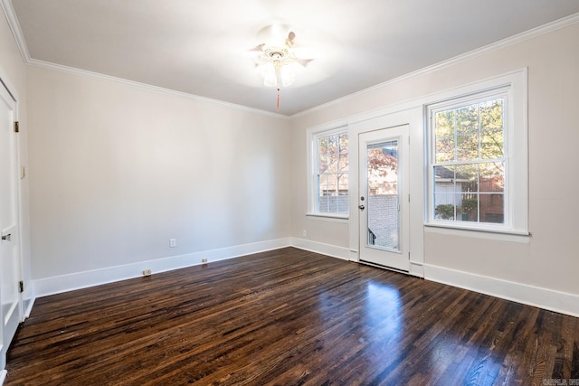 empty room with ceiling fan, ornamental molding, and dark hardwood / wood-style floors