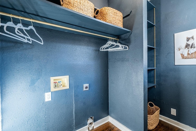 laundry room featuring hookup for an electric dryer, washer hookup, and dark hardwood / wood-style flooring