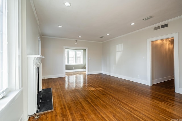 unfurnished living room with ornamental molding and dark hardwood / wood-style floors