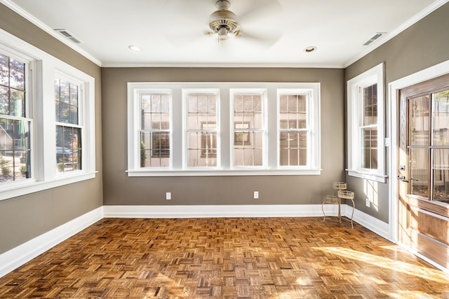 unfurnished sunroom featuring ceiling fan