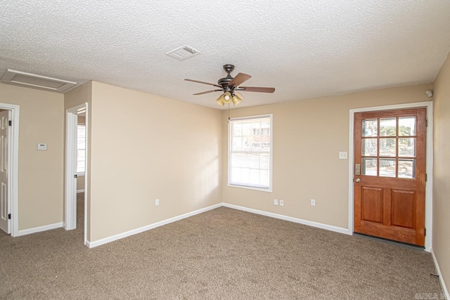 interior space with a wealth of natural light and carpet flooring