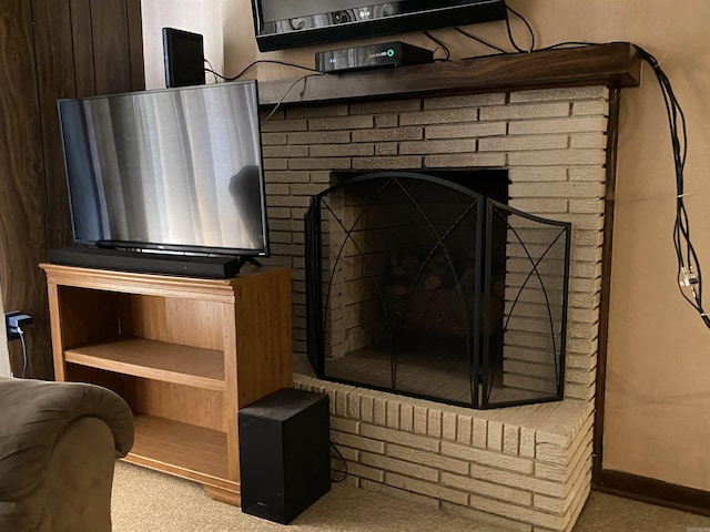 details featuring a fireplace and carpet floors