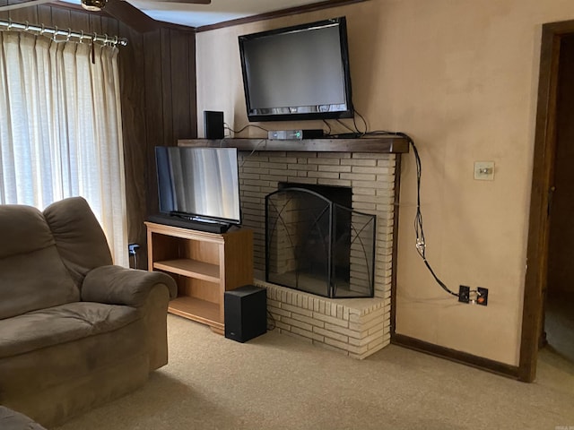 carpeted living room with ceiling fan and a brick fireplace