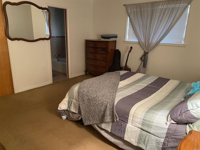 bedroom with carpet and ensuite bathroom