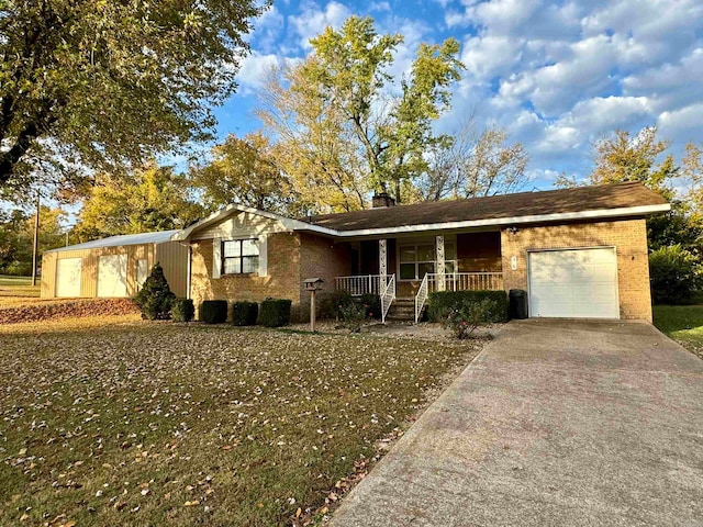 ranch-style home with a porch and a garage