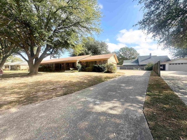 view of front of house with a front yard and a garage