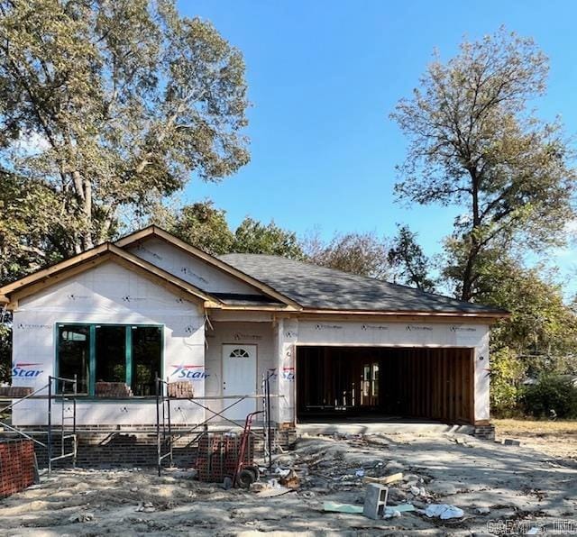 unfinished property with a garage