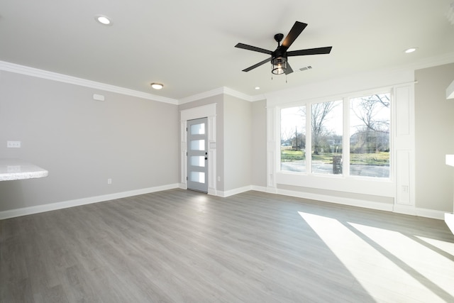 interior space with crown molding, ceiling fan, and wood-type flooring