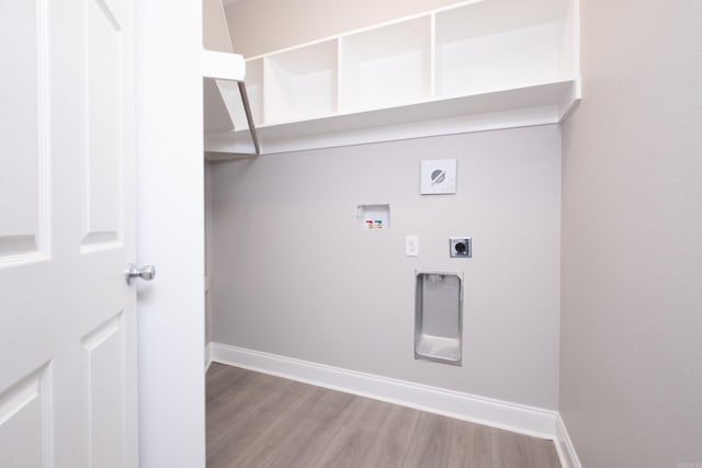 washroom featuring hookup for an electric dryer, hookup for a washing machine, and light wood-type flooring