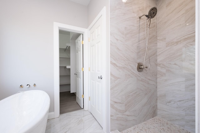 bathroom featuring shower with separate bathtub