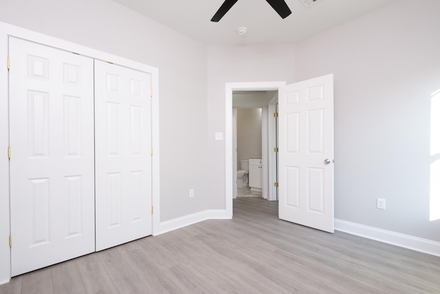 unfurnished bedroom featuring a closet, ceiling fan, and light wood-type flooring