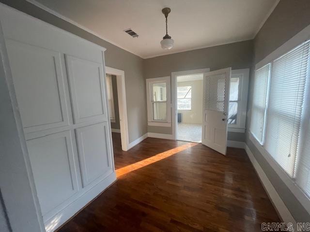 doorway with dark hardwood / wood-style flooring