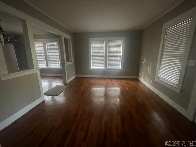 spare room with dark hardwood / wood-style flooring